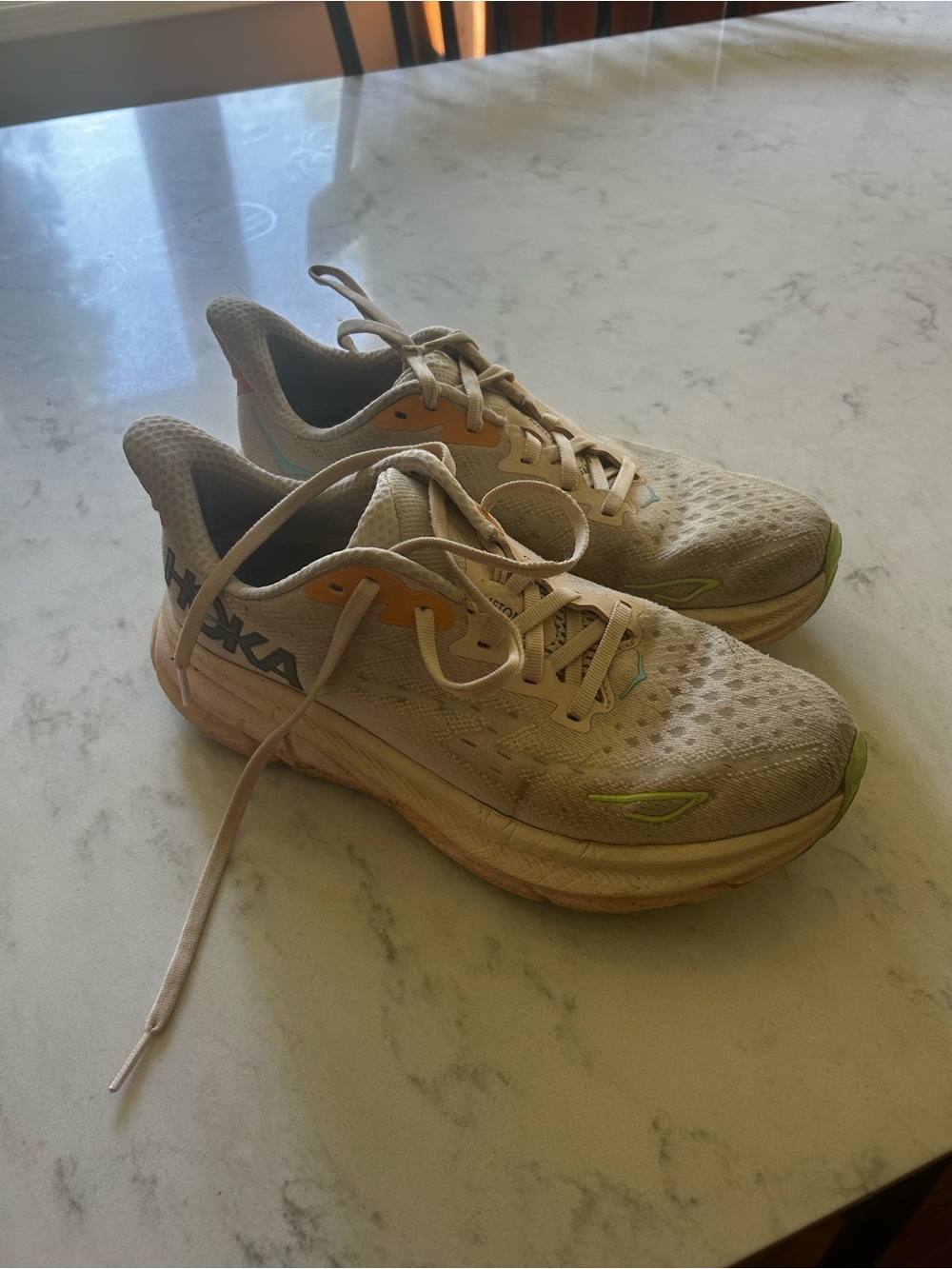 Hoka Neutral Running Shoes in Beige with Lime and Orange Accents